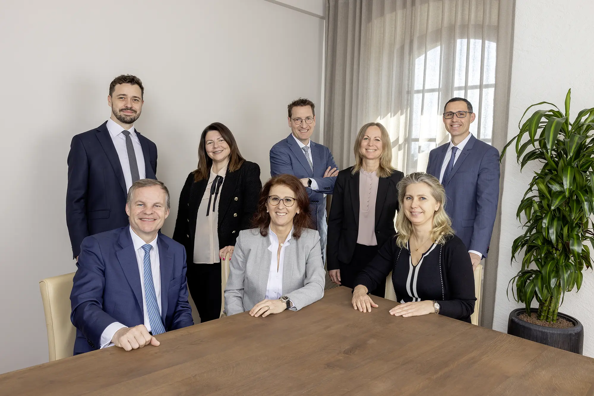 Business team posing around table.