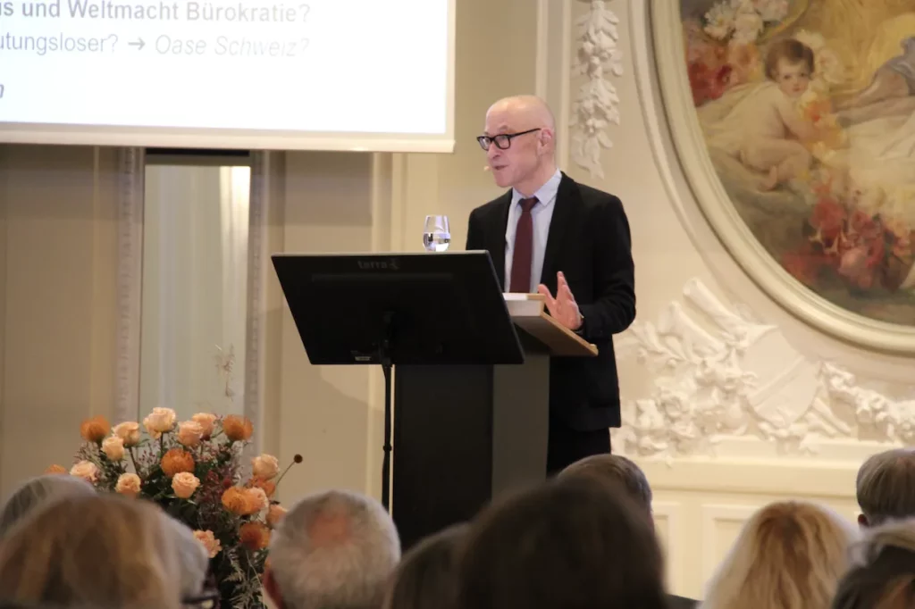 Person giving a speech at a podium