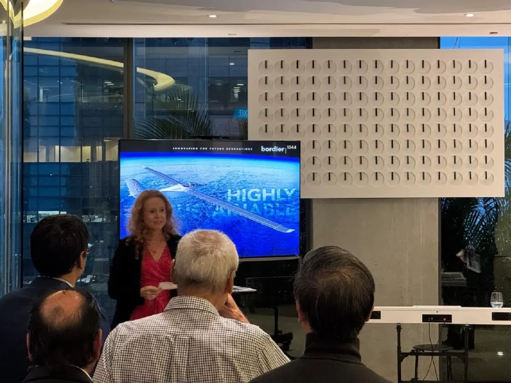 Speaker presenting aerospace innovation to audience