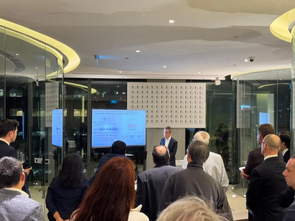 Business presentation with attendees in a modern office.