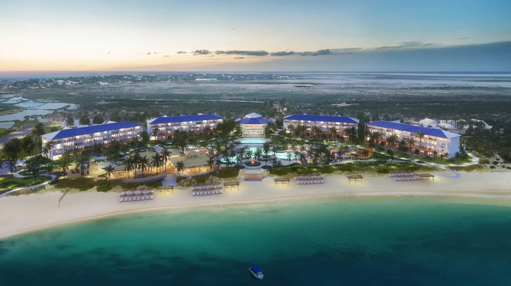 Luxury beach resort at sunset with ocean view.