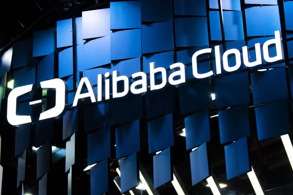 Alibaba Cloud logo on blue geometric background.