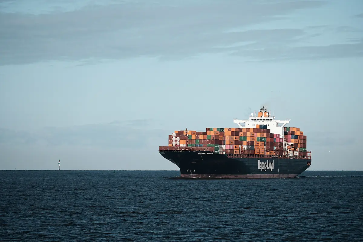 Cargo ship loaded with containers at sea.