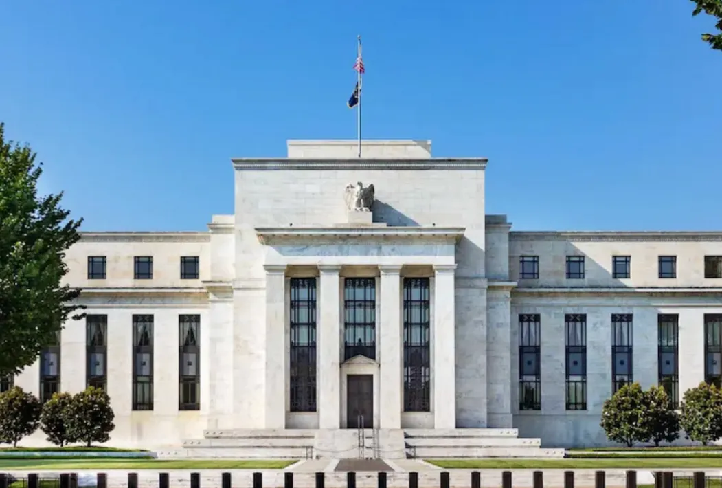 Federal Reserve building exterior with blue sky.