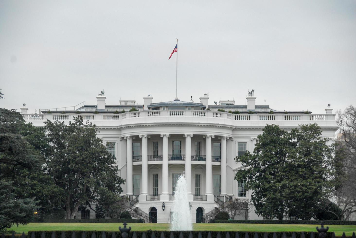 White House with American flag and fountain