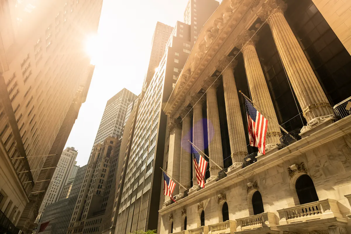 New York Stock Exchange building in sunlight.