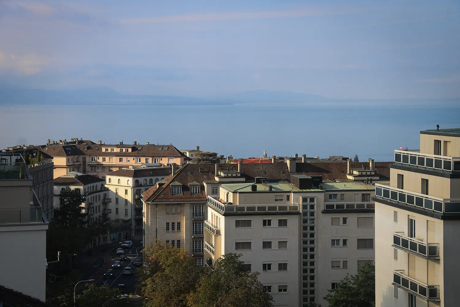 Cityscape with buildings and view of a lake