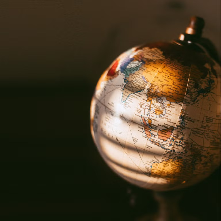 Close-up of a globe in warm light.